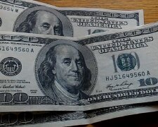 Доллары. Фото: скриншот youtube-видео