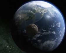 Приближение астероида к планете Земля.  Фото: скриншот YouTube-видео